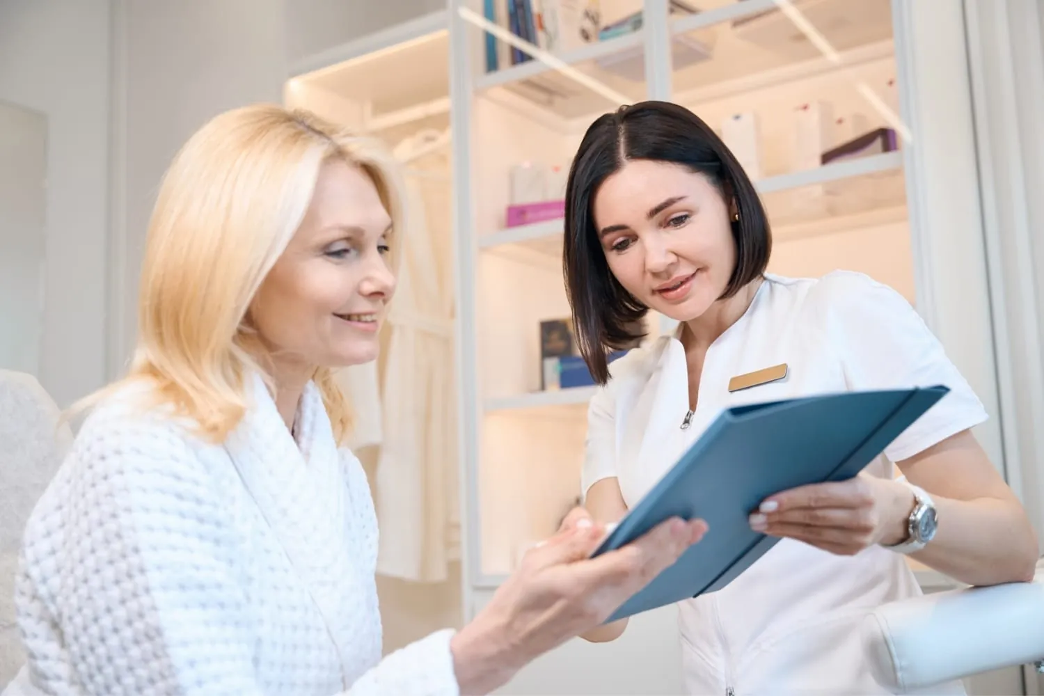 Esthetician in a consultation with a client